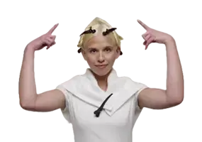 Woman sectioning blonde hair into four parts for Wella ColorCharm toner application