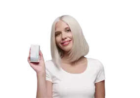 Blonde woman rinsing hair with shampoo after Wella ColorCharm toner treatment